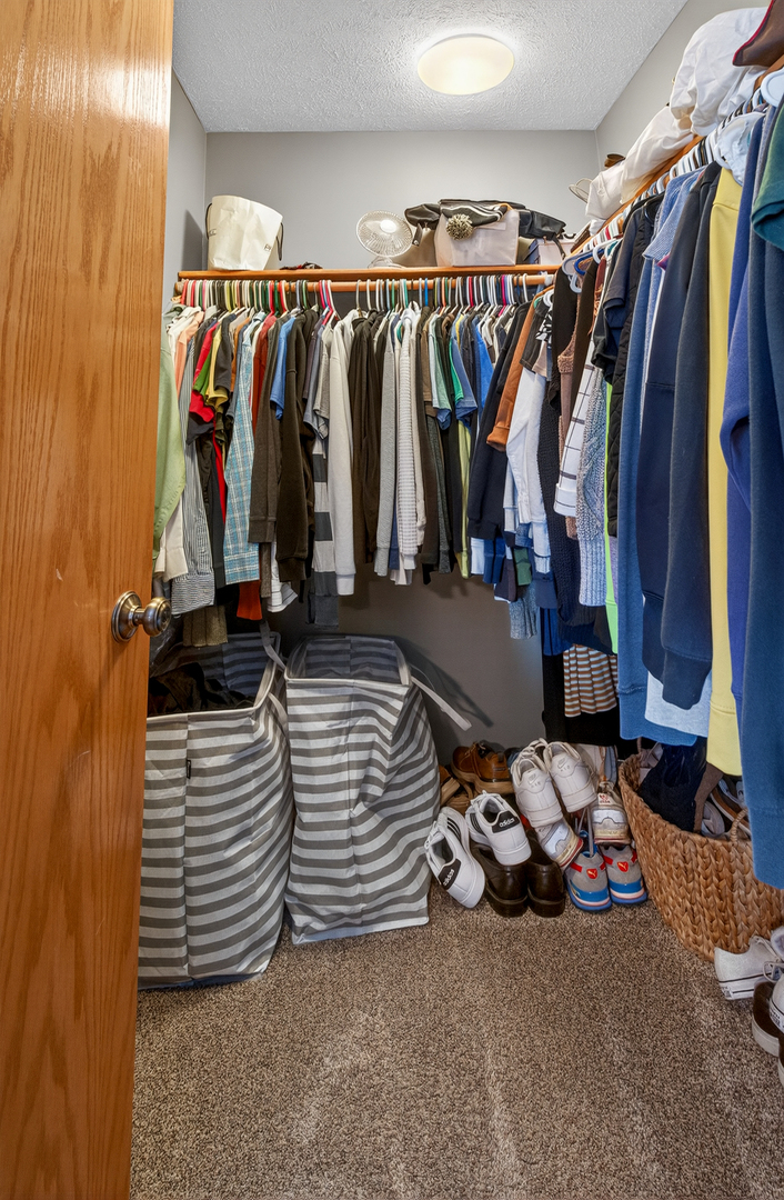 2712 North 13th Street Clinton, IA 52732 - Photo 19 of 47 a view of walk in closet with clothes and shoes