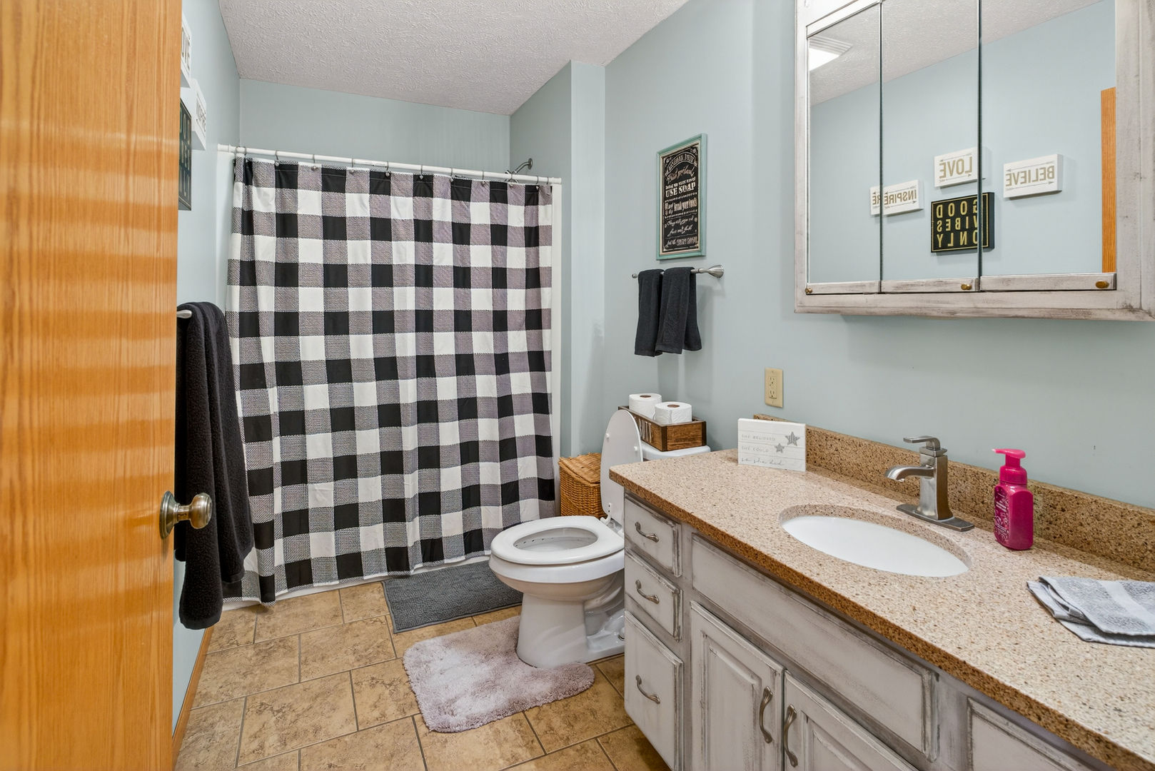 2712 North 13th Street Clinton, IA 52732 - Photo 26 of 47 a bathroom with a sink toilet and shower