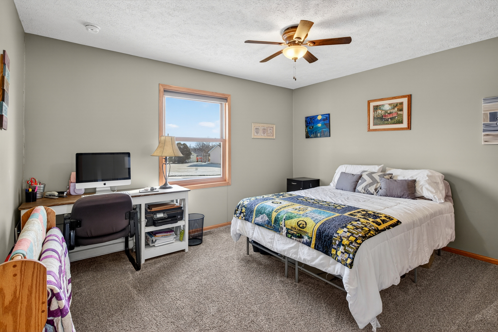 2712 North 13th Street Clinton, IA 52732 - Photo 28 of 47 a bedroom with a bed and a desk