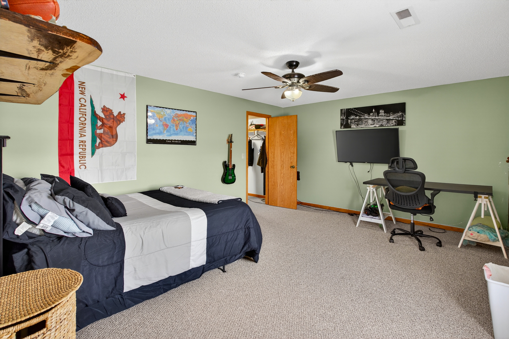 2712 North 13th Street Clinton, IA 52732 - Photo 33 of 47 a bedroom with a bed a chair and a chandelier