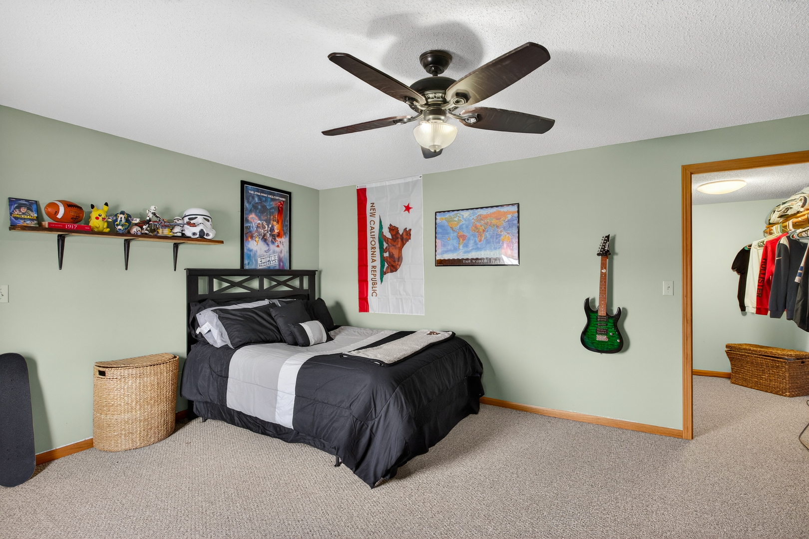 2712 North 13th Street Clinton, IA 52732 - Photo 34 of 47 a bedroom with a bed and a chandelier