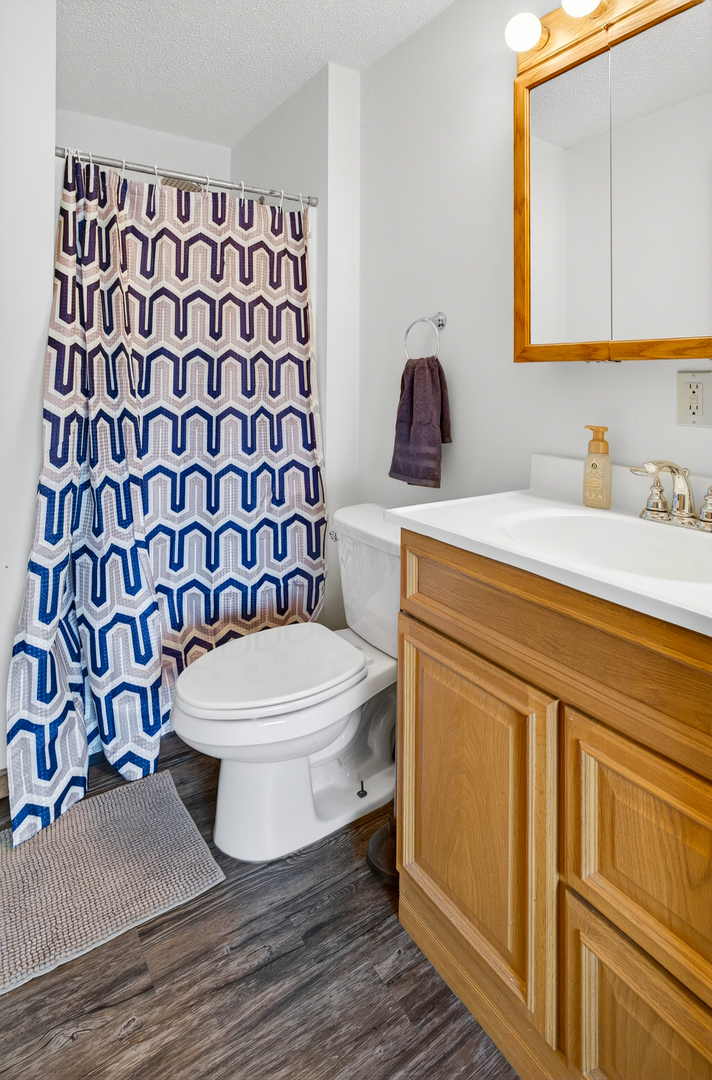 2712 North 13th Street Clinton, IA 52732 - Photo 36 of 47 a bathroom with a sink and a toilet
