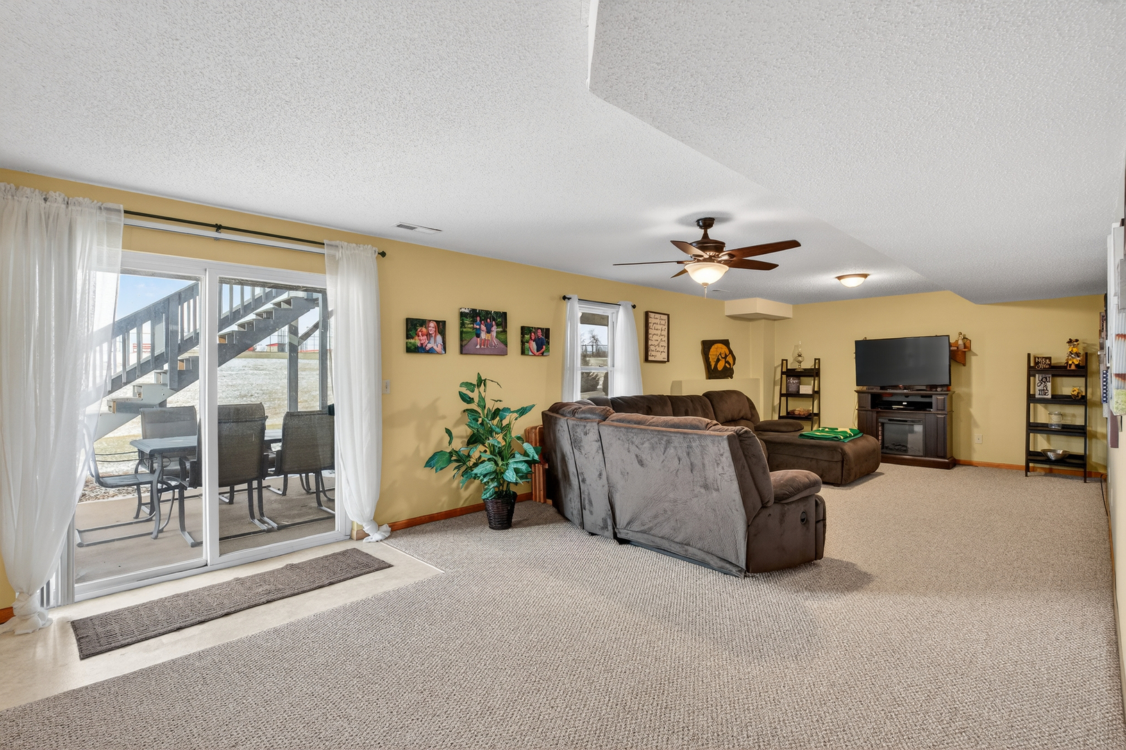 2712 North 13th Street Clinton, IA 52732 - Photo 40 of 47 a living room with furniture and a chandelier