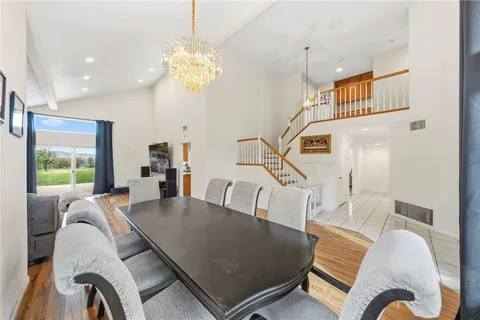 a kitchen with a stove a sink a microwave a refrigerator and cabinets