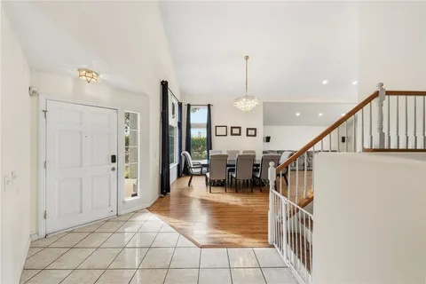 a large kitchen with lots of counter space and stainless steel appliances