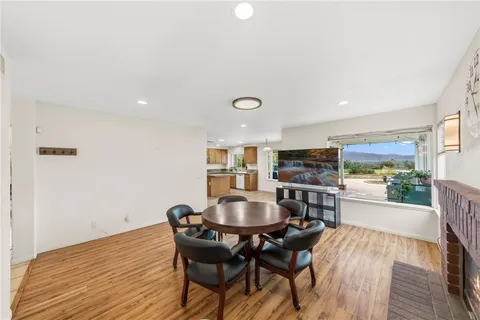 a view of a balcony with chair and wooden floor