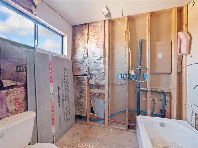 a bathroom with a shower curtain and a sink