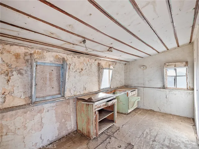 a kitchen with a stove and a refrigerator