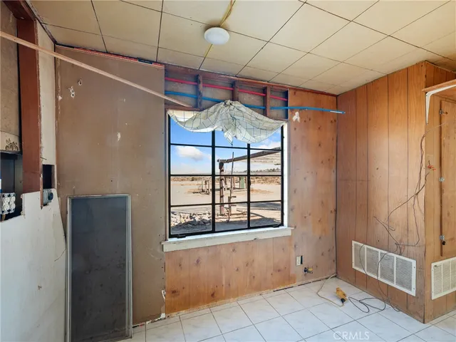 a view of empty room with windows