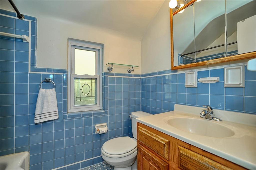 2381 Collins Road Pittsburgh, PA 15235 - Photo 14 of 20 a bathroom with a sink a toilet and mirror