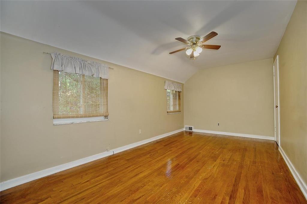 2381 Collins Road Pittsburgh, PA 15235 - Photo 17 of 20 a view of an empty room with wooden floor and a fan