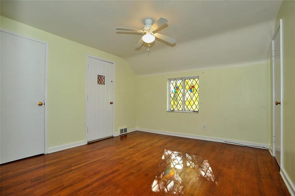 2381 Collins Road Pittsburgh, PA 15235 - Photo 18 of 20 a view of an empty room with window and wooden floor