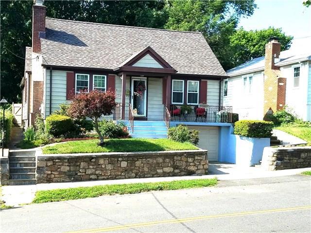 280 Robin Street Bridgeport, CT 06606 - Photo 1 of 1 a front view of a house with a yard and potted plants