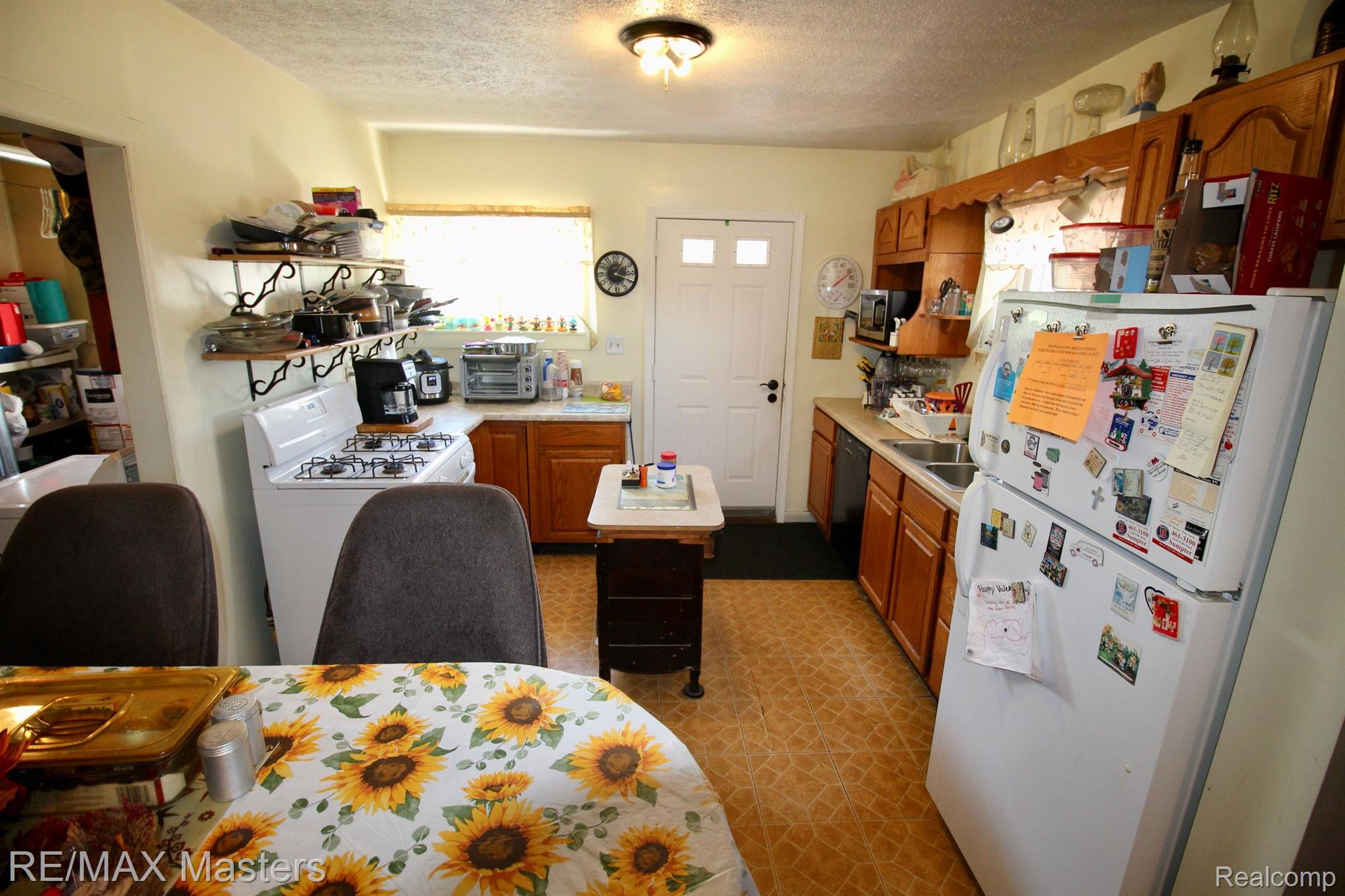 12527 Sumpter Road Carleton, MI 48117 - Photo 11 of 33 Kitchen has small island and plenty of cabinets.