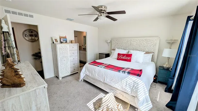 a bedroom with a bed and a walk in closet