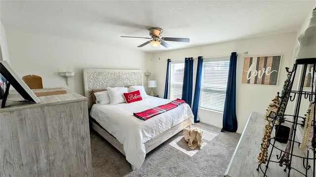 a bed room with a bed and a chandelier