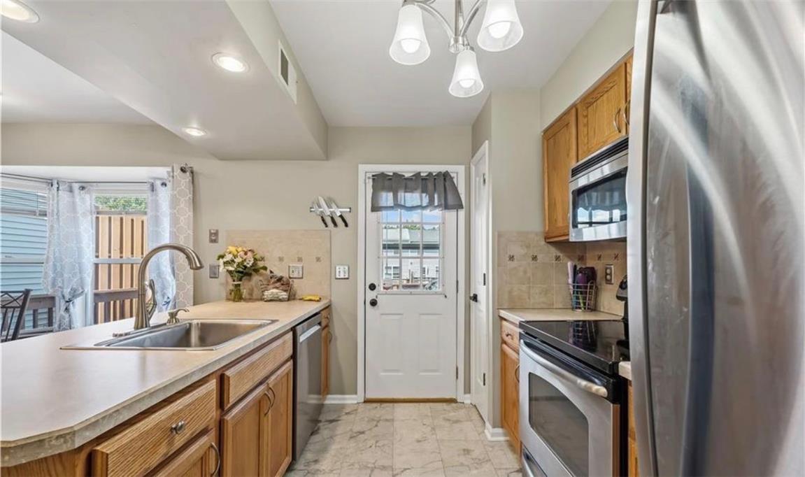 309 Hill Road Whitehall, PA 18052 - Photo 18 of 19 A well-equipped kitchen features a functional layout with ample counter space and modern appliances.