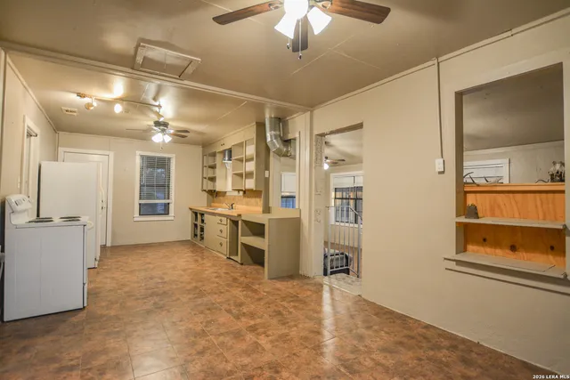 a view of an empty room with a closet