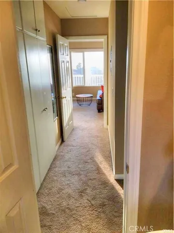 a balcony with table and chairs