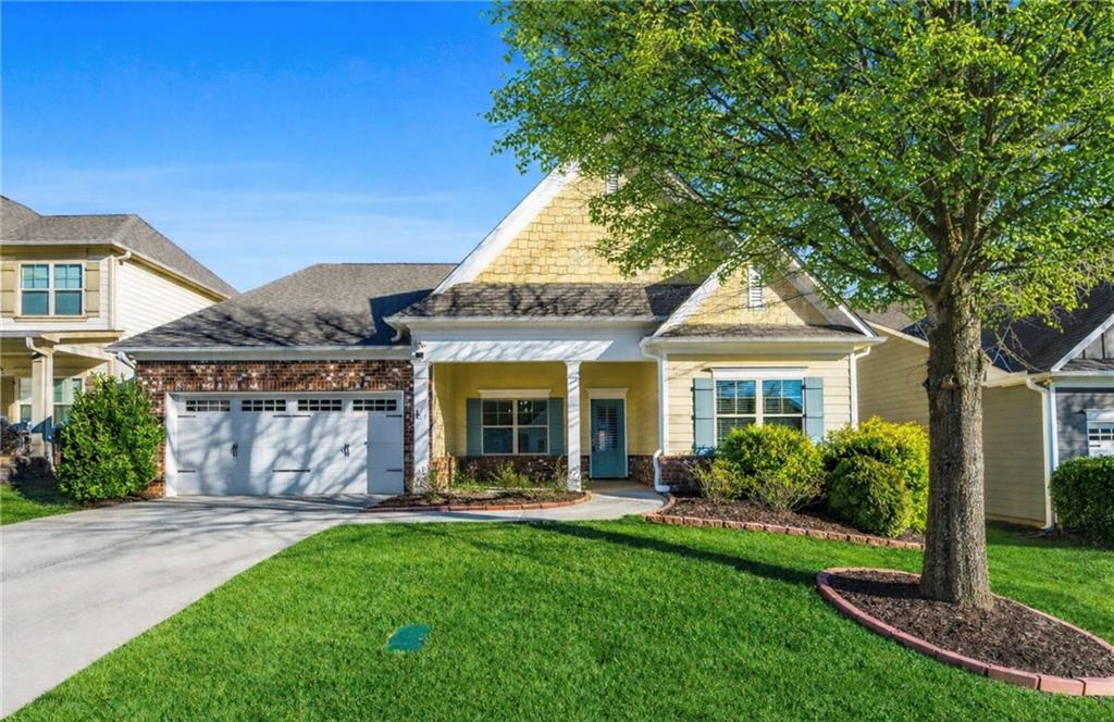 a front view of a house with garden