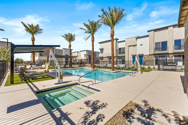 a view of a swimming pool with a lounge chairs