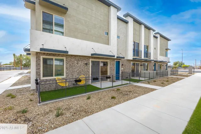 a front view of a house with a yard and porch