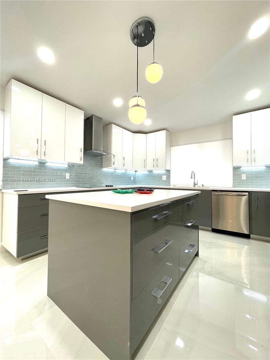 6726 Via Regina Boca Raton, FL 33433 - Photo 2 of 35 a kitchen with stainless steel appliances granite countertop a sink a stove and a refrigerator