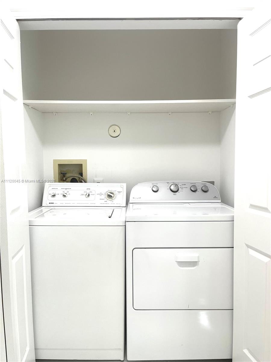 6726 Via Regina Boca Raton, FL 33433 - Photo 12 of 35 a utility room with dryer and washer