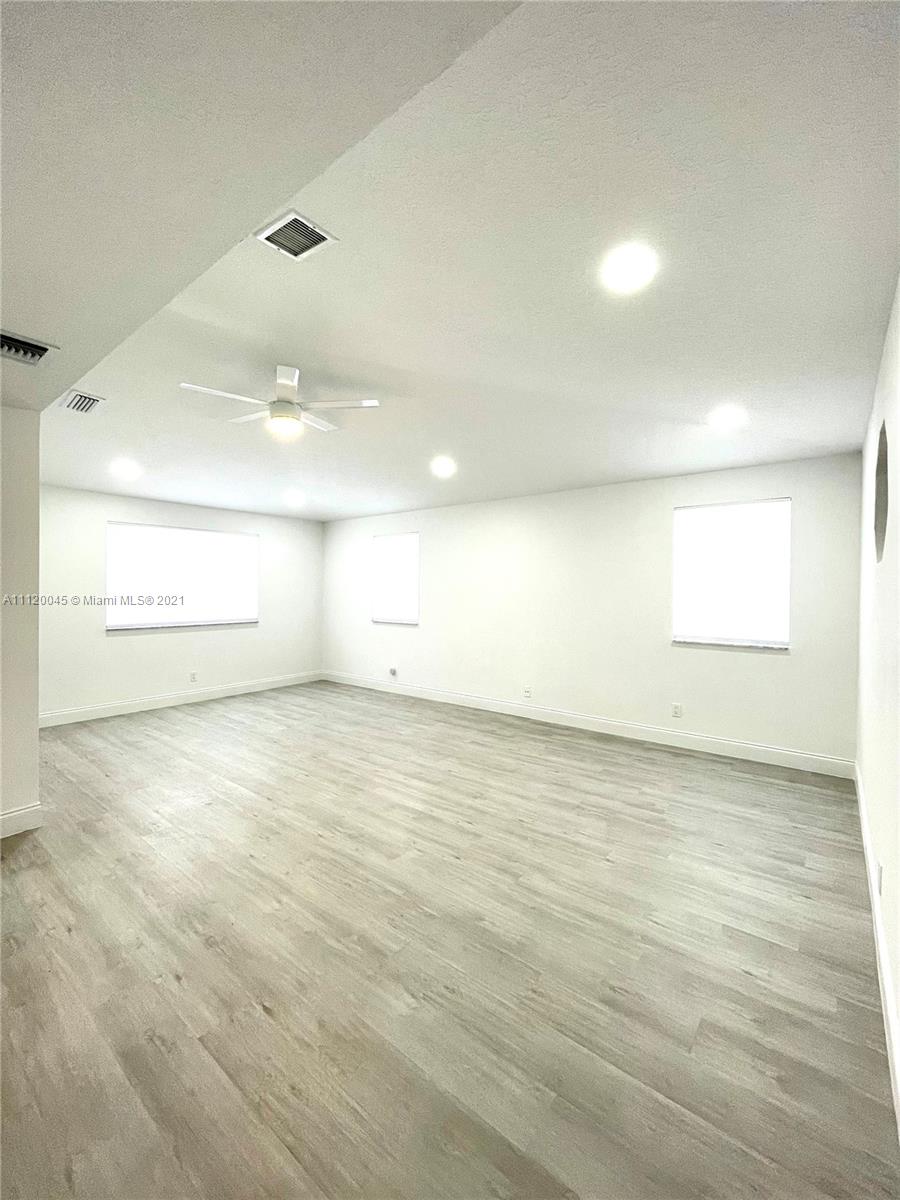 6726 Via Regina Boca Raton, FL 33433 - Photo 20 of 35 an empty room with a empty space and windows