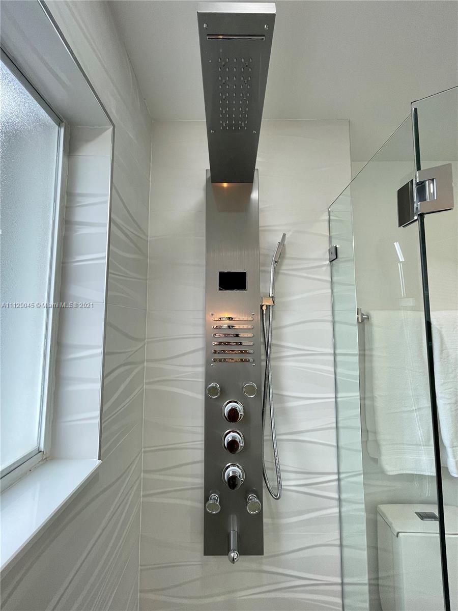 6726 Via Regina Boca Raton, FL 33433 - Photo 27 of 35 a bathroom with a shower