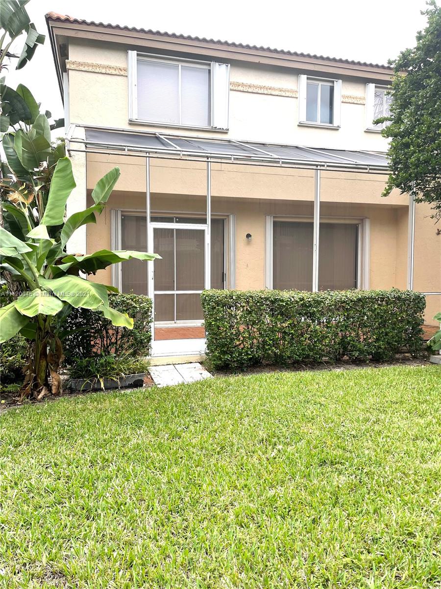 6726 Via Regina Boca Raton, FL 33433 - Photo 31 of 35 front view of a house with a yard