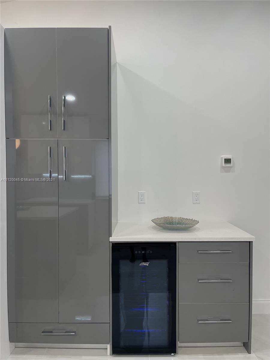6726 Via Regina Boca Raton, FL 33433 - Photo 6 of 35 a bathroom with a sink and mirror