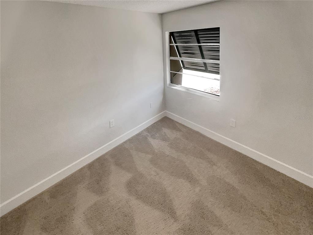 1028 Apollo Beach Boulevard, Unit 103 Apollo Beach, FL 33572 - Photo 14 of 22 an empty room with a window