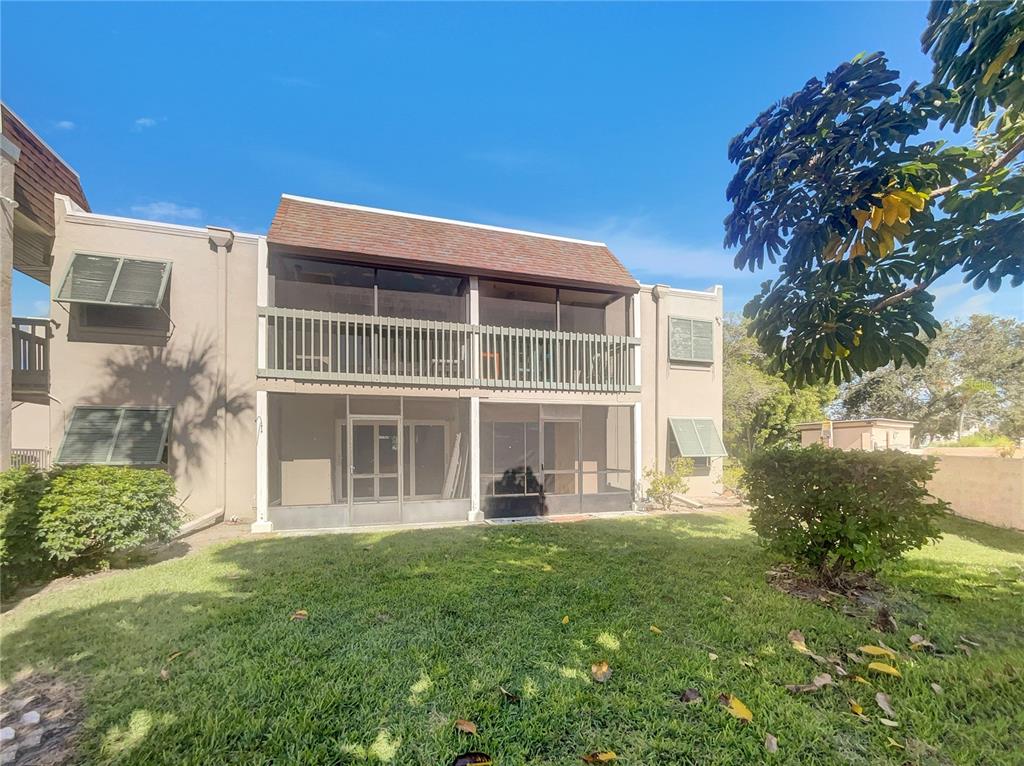 1028 Apollo Beach Boulevard, Unit 103 Apollo Beach, FL 33572 - Photo 19 of 22 front view of a house with a yard