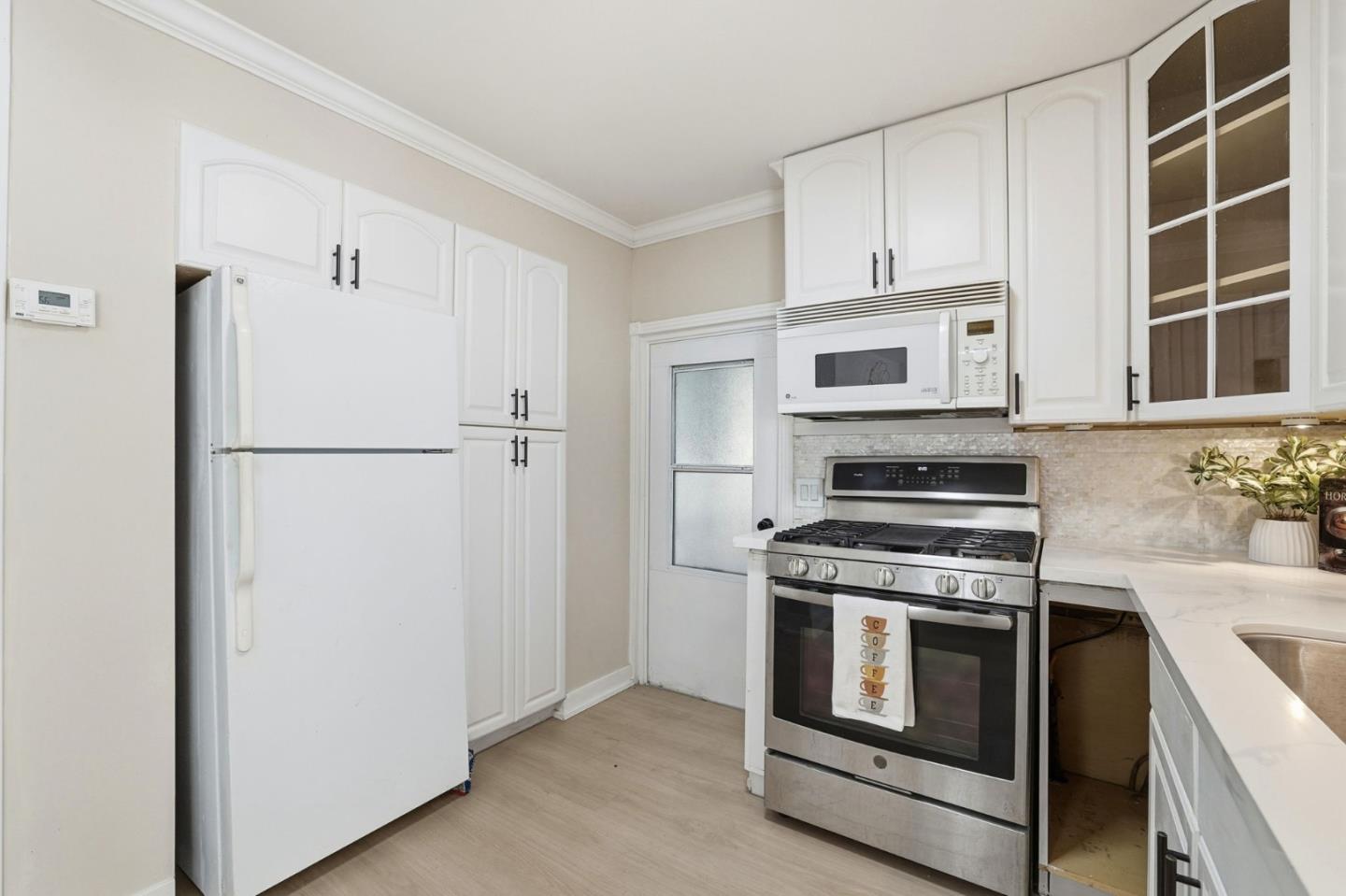 265 Brown Gables Road, Unit 11 Ben Lomond, CA 95005 - Photo 10 of 50 a kitchen with cabinets and stainless steel appliances