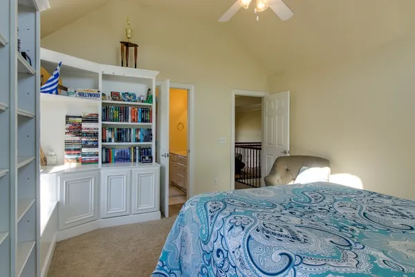 a bedroom with a bed and closet