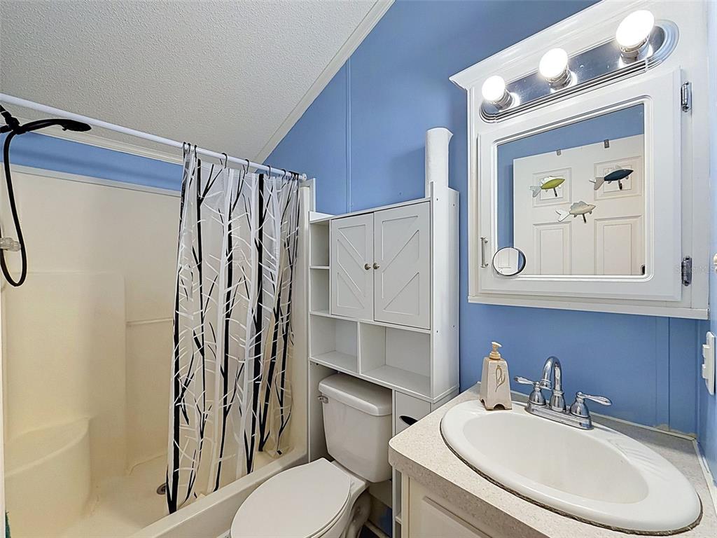 2092 Culbreath Road, Unit A42 Brooksville, FL 34602 - Photo 58 of 70 a bathroom with a sink toilet and shower