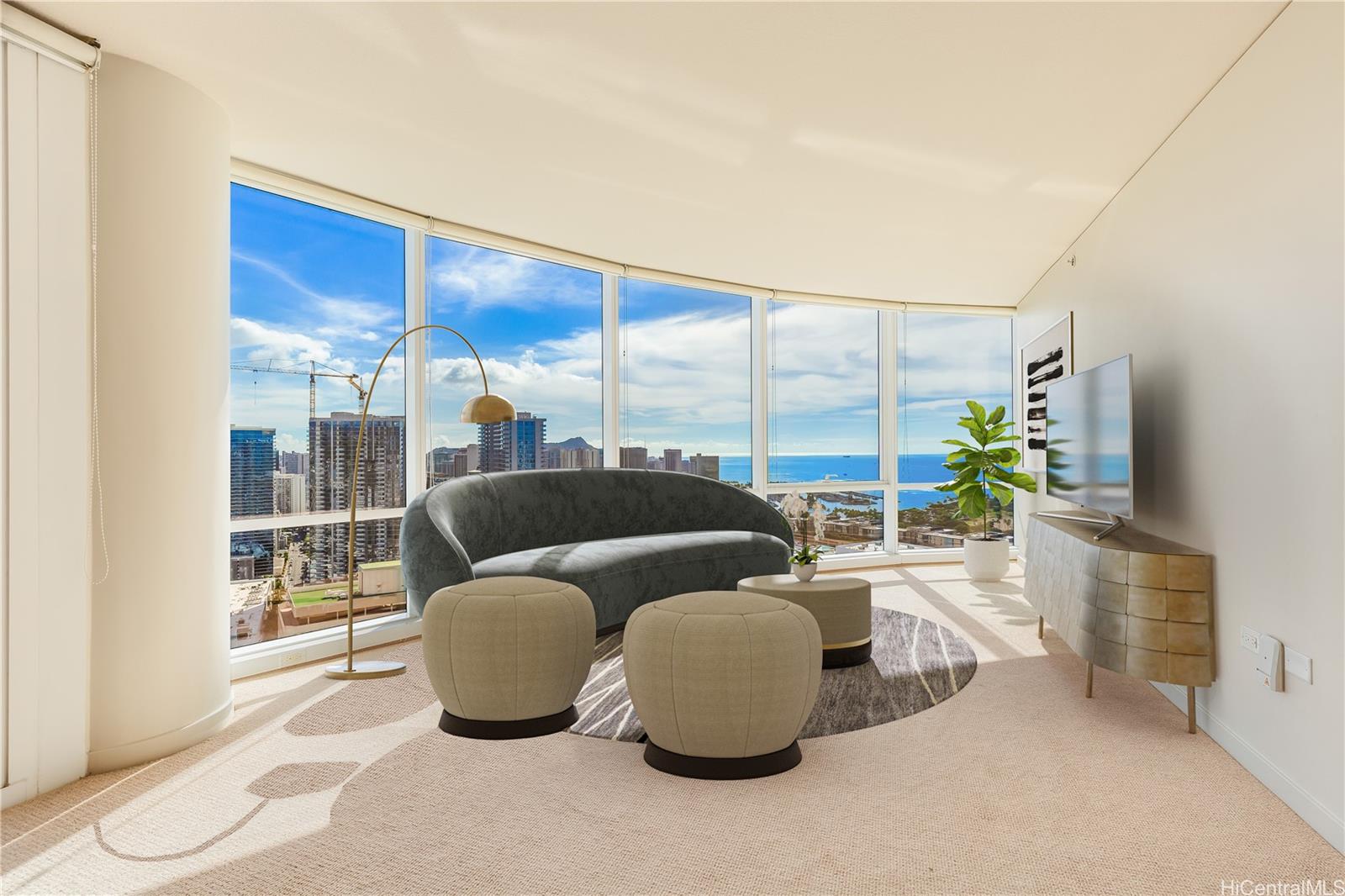 a living room with furniture and a floor to ceiling window