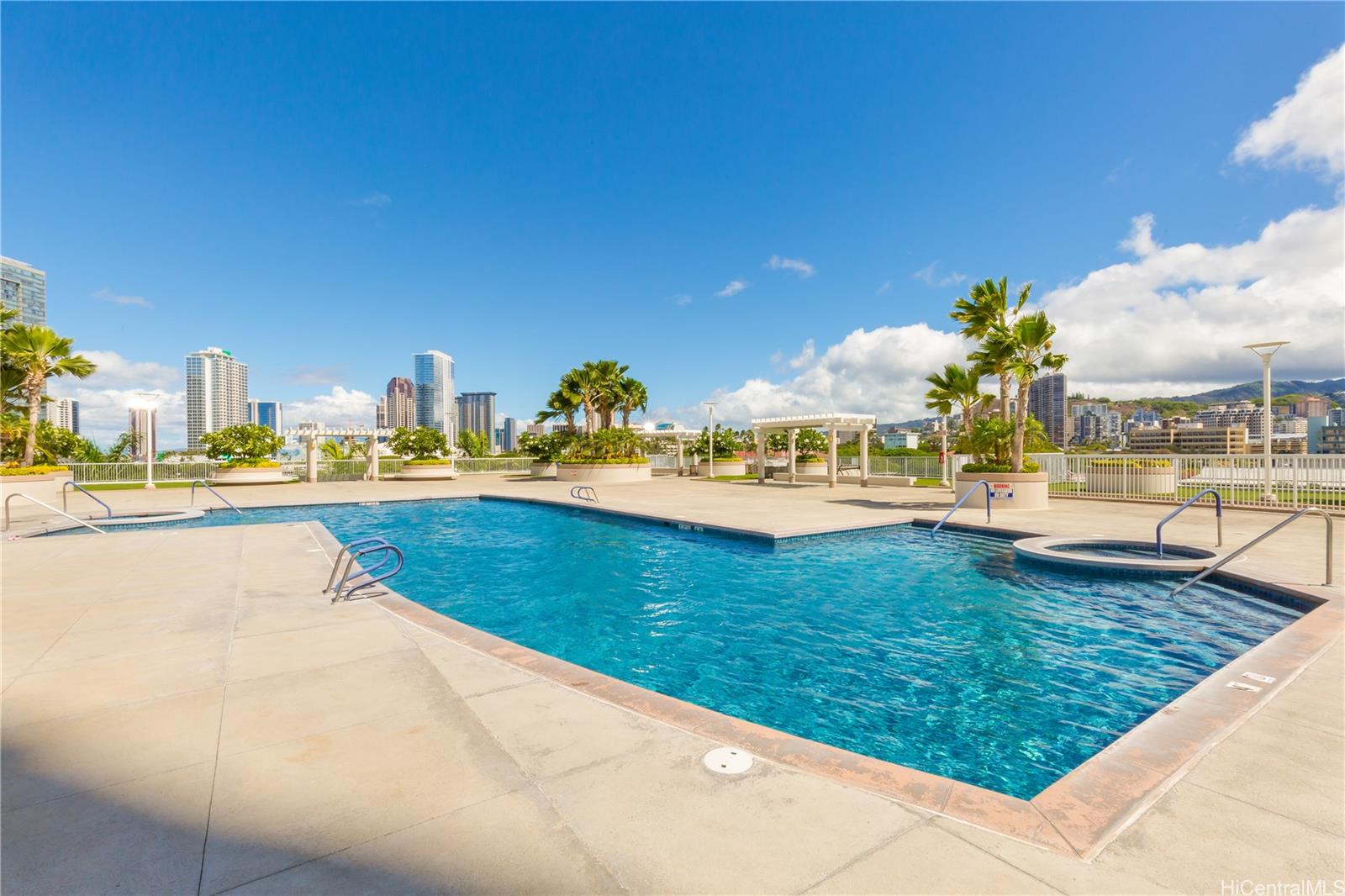 1288 Kapiolani Boulevard, Unit I4203 Honolulu, HI 96814 - Photo 17 of 25 a view of swimming pool with outdoor seating