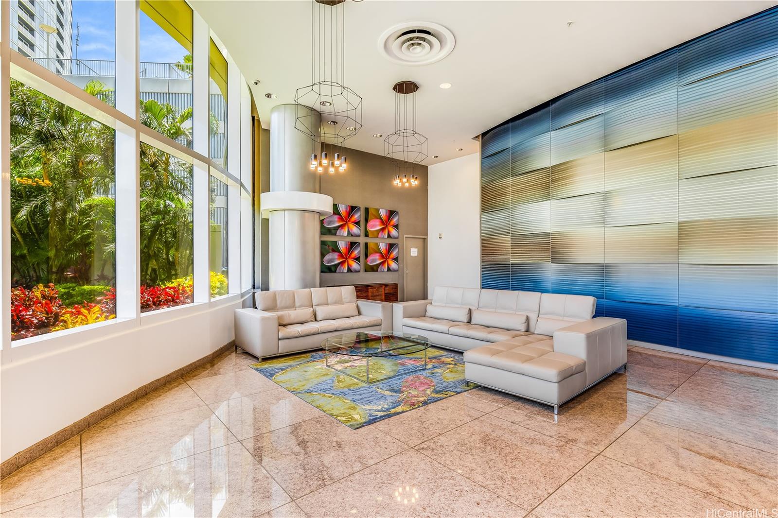 1288 Kapiolani Boulevard, Unit I4203 Honolulu, HI 96814 - Photo 22 of 25 a living room with furniture and a large window