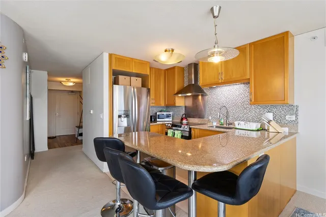 a dining table chairs and a chandelier