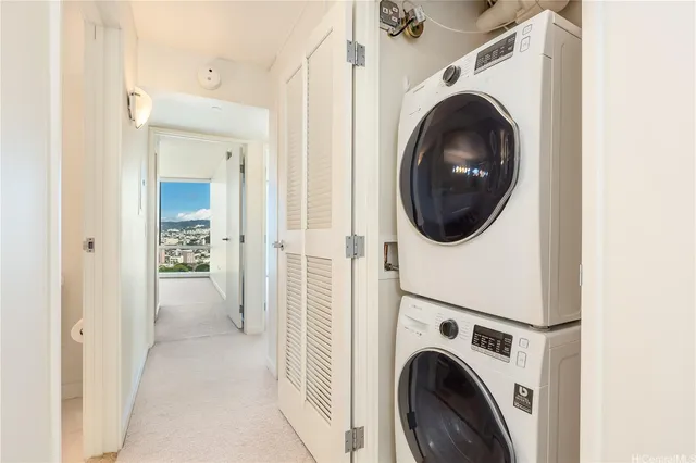a view of a hallway with washer and dryer