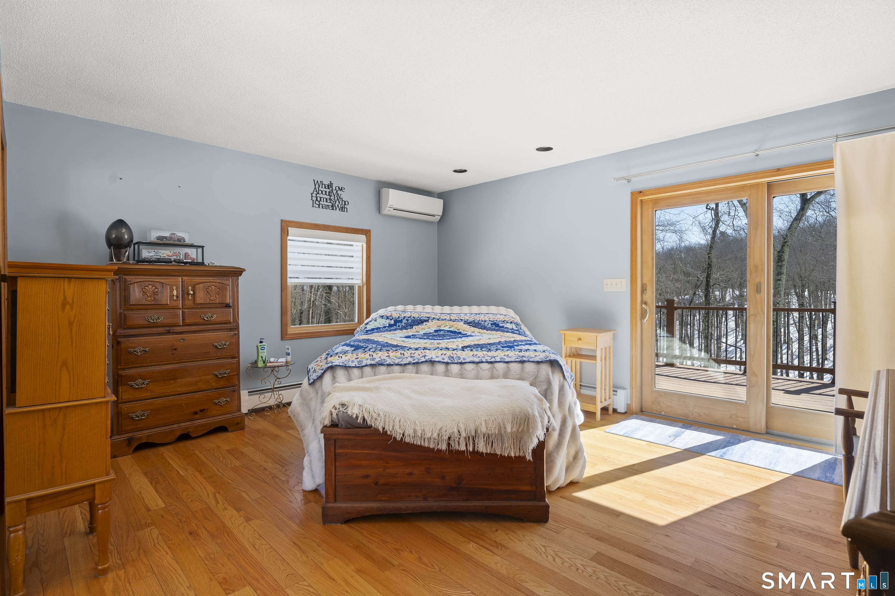 172 Old Willimantic Road Columbia, CT 06237 - Photo 11 of 39 a bedroom with a bed and wooden floor