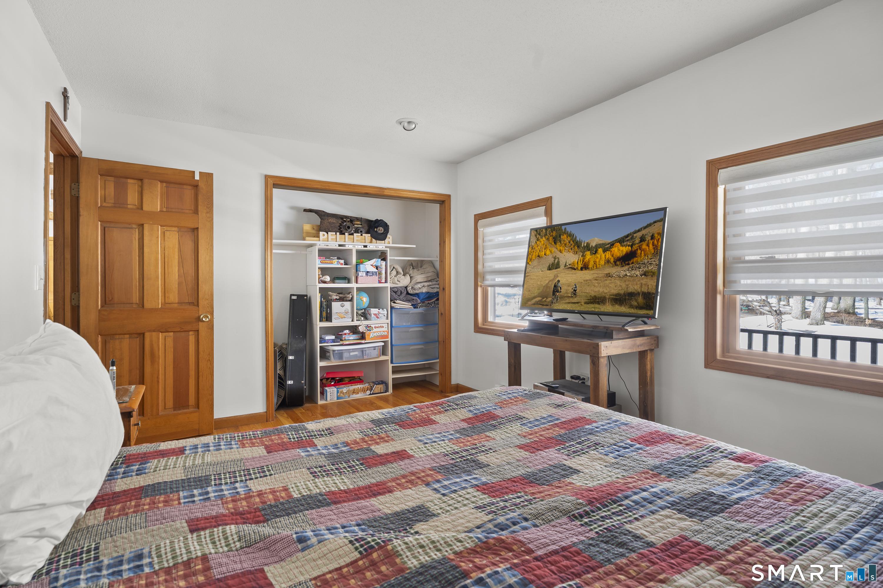 172 Old Willimantic Road Columbia, CT 06237 - Photo 19 of 39 a bedroom with a bed and a flat screen tv