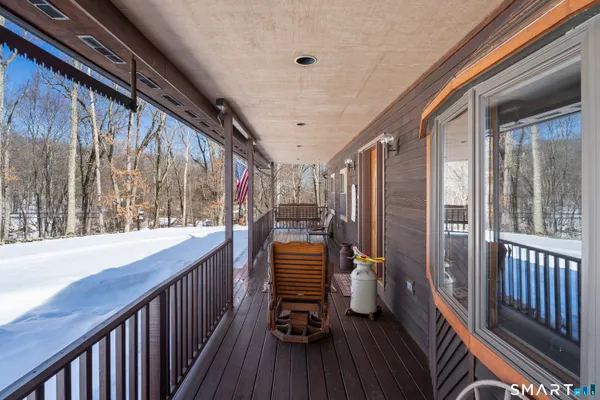 a view of two chairs in the balcony