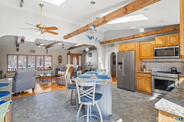 a view of a dining room with furniture window and outside view