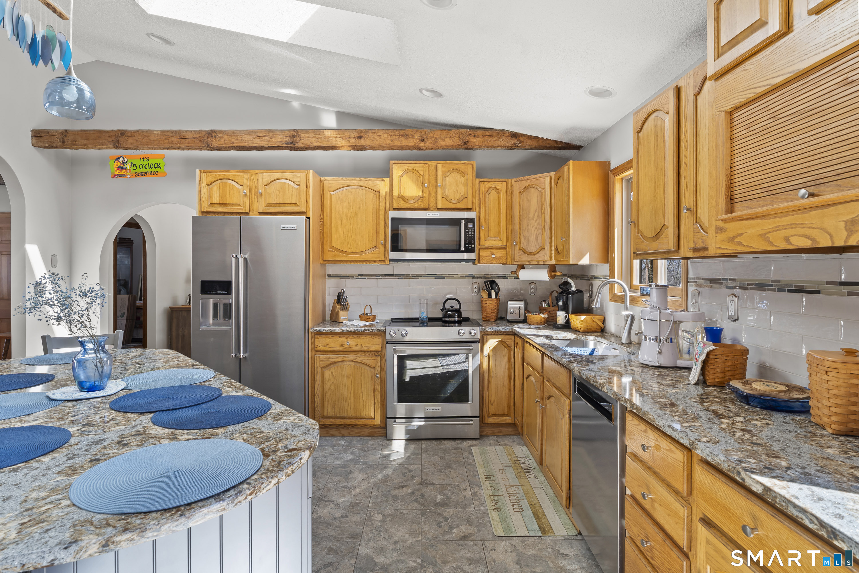 172 Old Willimantic Road Columbia, CT 06237 - Photo 28 of 39 a kitchen with stainless steel appliances granite countertop a stove a sink and a refrigerator