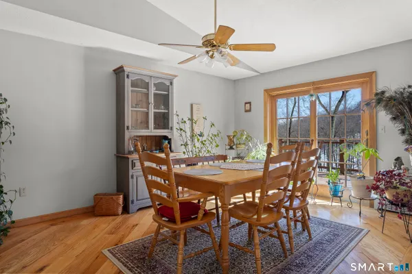 a view of hallway with livingroom and furniture