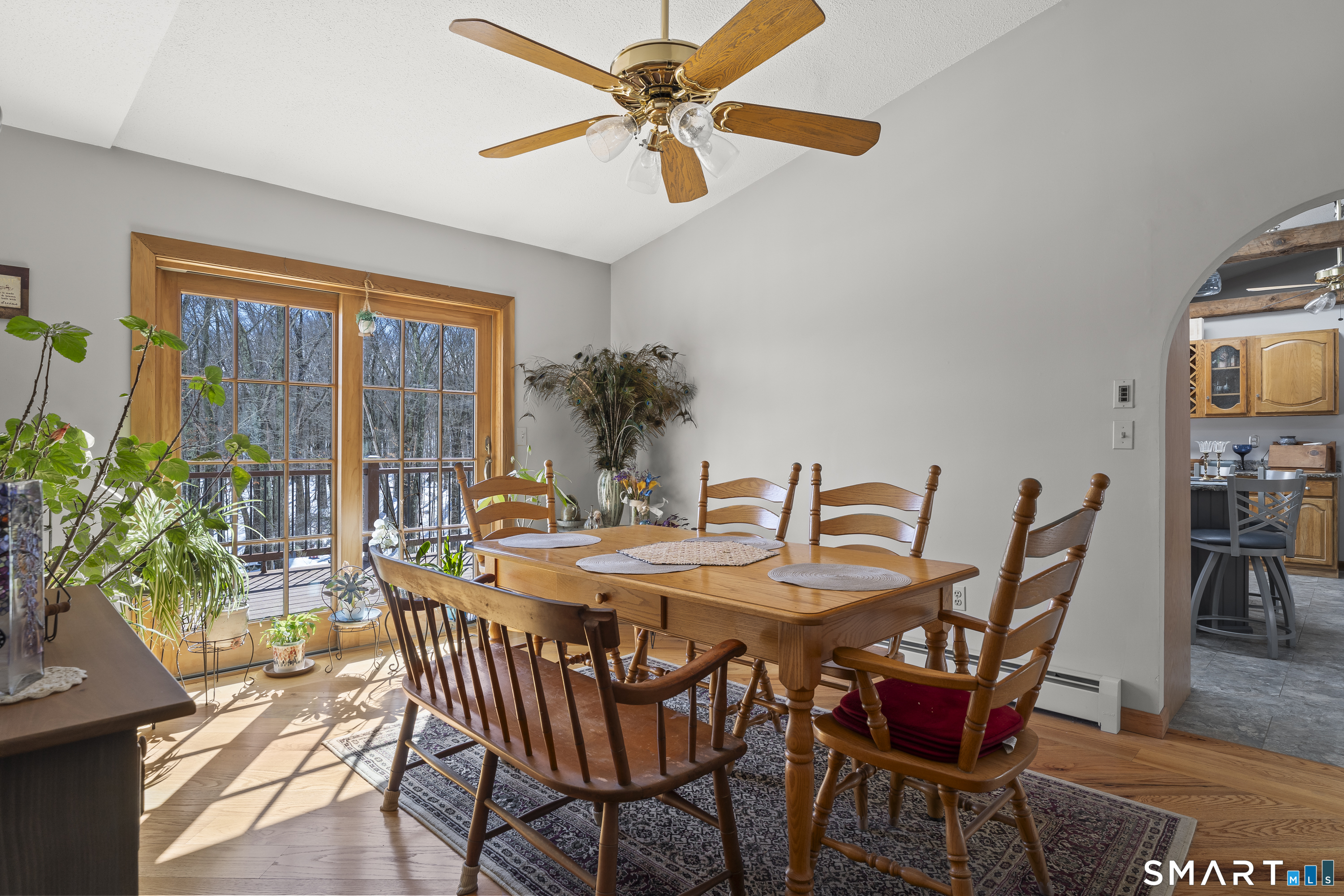 172 Old Willimantic Road Columbia, CT 06237 - Photo 30 of 39 a dining room with furniture a window and a chandelier