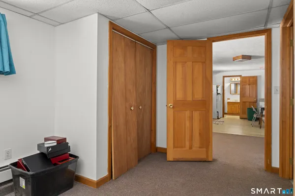 a work place with stainless steel appliances kitchen island furniture and a window
